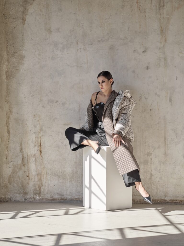 Coat, puffer jacket and trousers Tommy Hilfiger, corset Maucerieffe, earcuffs Mam Originals, shoes stylist’s archive