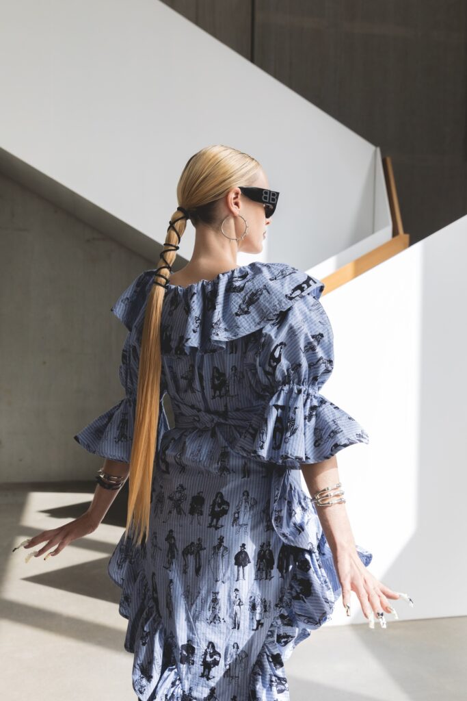 Dress Vivienne Westwood, sunglasses Balenciaga by Kering, jewels Bernard Delettrez 